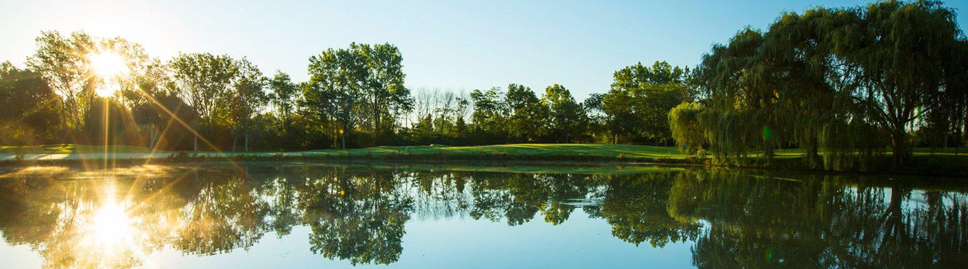 view of golf course at twilight